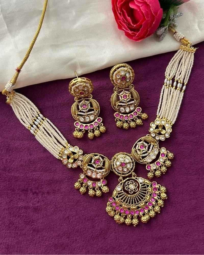 Traditional Gold Finish Pearl Necklace Set with Kundan Work & Pink Stone Pendant