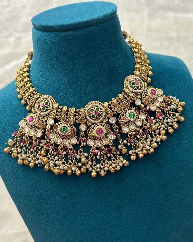 Traditional Gold Finish Temple Necklace Set with Green Enamel, Pink Stones & Pearl Drops